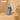Blue handbag with a patterned strap on a beige surface, featuring the Wrangler brand.
