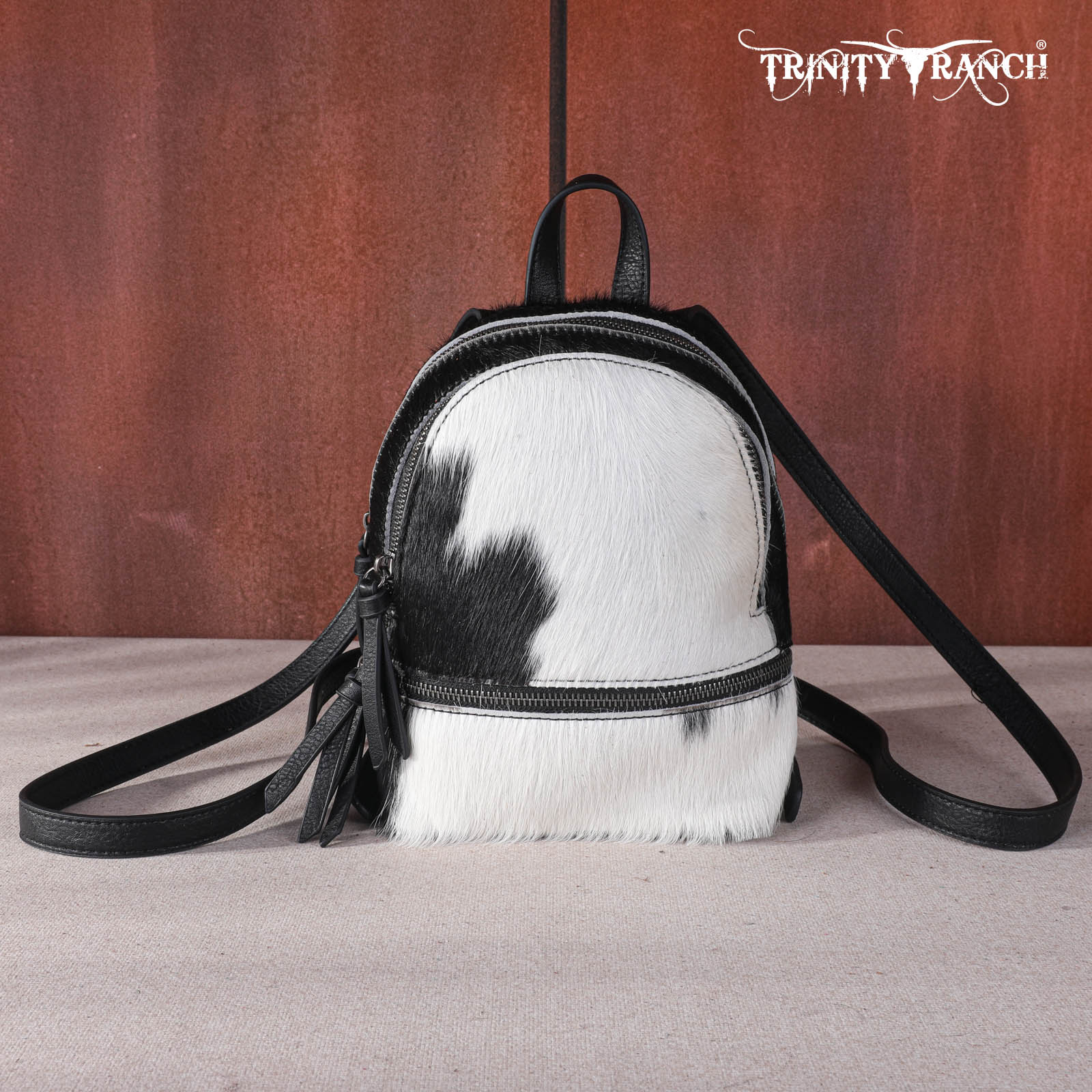 convertible backpack in black & white cowhide leather TR160-9110 Trinity Ranch Hair-On Cowhide Collection Mini Backpack – MONTANA WEST U.S.A