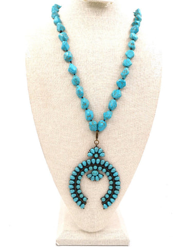 NKS190203-02 BLU-TURQ/BRS Blue-turquoise bead knotted necklace with blue-turquoise brass plated squash blossom pendent